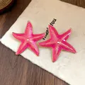 Detailed close-up of vibrant pink enamel starfish stud earrings with gold trim. - Starfish Style (Silver Post) / Rose Red