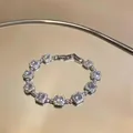 Detailed view of a luxury 18k white gold plated bracelet with square cubic zirconia - Silver