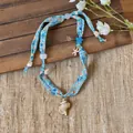 Close-up detail of the beach-themed fabric printed necklace with shell and starfish charms - Blue Horn Snail (Necklace 4#)