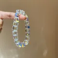 Nahaufnahme von schillernden facettierten Kristallwürfelperlen auf einem Armband - Schillerndes facettiertes Design (34#) / Weiß-10mm