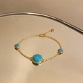 Detail view of 18K gold plated bracelet with turquoise resin and zircon flowers - 1# Bracelet / Gold-Blue