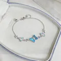 Elegant silver butterfly bracelet with blue gradient wings and sparkling zircon detail. - Silver & Blue
