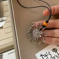 Silver retro flower pendant long necklace featuring a vibrant orange bead accent. - Hollow Flower / Silver
