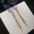 Elegant gold-plated long tassel earrings with sparkling zircon floral tops on white box - 4# (HE31465)