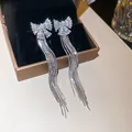 Silver bow tassel earrings with sparkling cubic zirconia and elegant long chain drops. - 7# (HE31465)