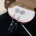 Elegant silver-toned earrings with flower studs and long cubic zirconia tassels. - 13# (HE31465)
