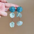 Light blue glass flower and acrylic petal tassel earrings with silver needles - Silver Needle / Blue Flower