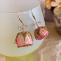Elegant gold-tone dried pink rose bud earrings with sparkling zircon bow-tie detail. - 18# Ear Hook - Pink