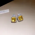 Close-up of luxury square yellow zircon stud earrings with sparkling crystal accents - Stud Earrings (Silver Pin) / Silver (Yellow Main Stone)