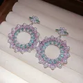 Close-up of ornate floral wreath earrings with pink zircon and white pearls - Flower Wreath Style (HE33728) / Silver-Pink-Green