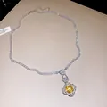 Detailed close-up view of zircon necklace featuring square yellow gemstone pendant. - Pendant Necklace / Silver (Yellow Main Stone)