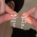 Elegant silver tassel stud earrings featuring shimmering teardrop zircon stones for women - 22# (HE31465)