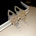 Elegant gold-tone geometric tassel chandelier earrings with brilliant baguette-cut cubic zirconia - 26# (HE31465)