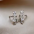 Detailed view of elegant star zircon ear clips for non-pierced ears in silver finish - Star Ear Cuff (Pair) / Silver