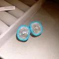 Close-up detail of silver-plated mesh stud earrings with blue beads and sparkling zircons - Silver Earring Post-Blue