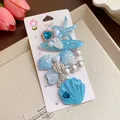 Detailed view of blue ocean-themed resin hair clips with shell and pearl accents - Duckbill Hair Clips / Five-Piece Set / Blue