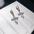 Elegant silver cross hoop earrings with sparkly zircons and shimmering shell inlay detail - Cross Style / Silver