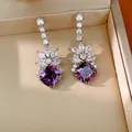 Elegant silver stud earrings with purple geometric stones and white cubic zirconia. - Silver Post Rhombus Style / Purple