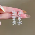 Elegant silver hollow flower tassel drop earrings for women in Korean minimalist style - Silver Pin Tassel Style / Silver
