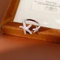 Detailed view of a silver-tone starfish open ring with sparkling pavé-set zirconia stones - Starfish Open Ring (HR3568) / Adjustable / Silver