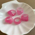 Set of five pink marble resin chunky rings displayed in a white shell dish holder. - 5 Pieces / Pink