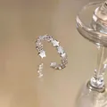 Detailed macro view of a silver open ring featuring alternating star and zircon designs - Star Design (2#) / Silver