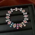 Detailed macro shot of a vintage flower bracelet with vibrant multi-colored zirconia stones - Flower Style / Silver Multicolor