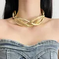 Close-up of a gold intertwined metal choker necklace with a textured wrinkled finish - Gold