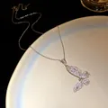 Exquisite detail of a silver butterfly pendant necklace with sparkling cubic zirconia stones - Silver-White