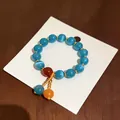 Bracciale coreano minimalista con perline occhio di gatto blu e ciondoli dorati - Stile 5 (HB5488)