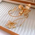 Close-up of gold pleated flower armlet with intricate metal petal texture - Wrapped Style Arm Cuff