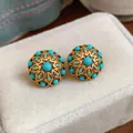 Macro detail of French retro 18k gold plated hollow floral earrings with turquoise beads - Silver Post Round Hollow Flower (HE33855) / Gold with Blue
