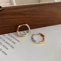 Close-up of 14k gold plated hoop earrings with colorful enamel bamboo segments. - 14k Gold Plated Ear Buckle / Gold-Multicolor