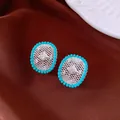 Macro detail of vintage oval earrings with silver hollow grid and turquoise beads - Silver-Blue