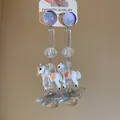 Detailed macro view showing the whimsical resin unicorn and star dangle earrings charms - Pony Star Dangle Style / White with Multicolored Stones