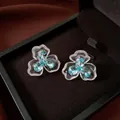 Elegant flower stud earrings featuring blue zircons presented in a premium gift box - Floral Style (HE33995) / White-Blue