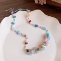 Close-up of a colorful dopamine style necklace with resin flowers and irregular stone beads - Necklace / Colorful