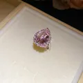 Detailed view of an elegant pink pear-cut zircon ring with sparkling accent stones - Ring (HR3508) / Pink