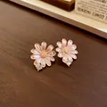 Close-up macro view of elegant pink enamel flower stud earrings with small crystal accent - Silver Post Stud (39)