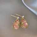 Detailed close-up view of pink gourd-shaped earrings with pearls and bamboo leaf accents - Silver Post Stud (51)