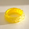 Detail macro view of the yellow resin bracelet showing wrinkled texture and smudge effect - Iridescent Yellow (Wrinkled Texture)