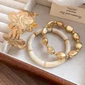 Vintage gold floral cuff bracelet paired with cream and gold beaded bangles for women - Flower Geometric Bracelet Set / Gold-Beige