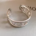 Detailed macro view of hollow starfish and seashell patterns on silver cuff bracelet - Sea Star Shell Hollow Style (6)