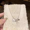 Detail view of dainty shell cat and bow pendant necklace with a pink heart charm - Cat Bow Pink Heart Pendant (Snake Chain) / Silver