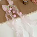 Vista dettagliata di un fermaglio per capelli con fiocco in organza rosa e fiori - Fermagli per capelli a becco d'anatra / Rosa