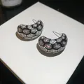 Detailed view of 18k gold plated C-hoop earrings with hexagonal zircon grid pattern - Stud Earrings / Silver