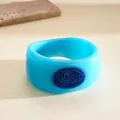 Vibrant blue resin bangle with dark blue marble drip oil oval detail - Sky Blue