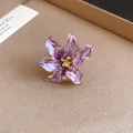 Detail view of a vintage-style purple enamel tulip flower ring with gold edges. - Open Ring / Purple