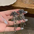 Detailed view of black flower stud earrings with elegant long tassel beads. - Flower Tassel Long Style (HE33437) / 925 Silver Needle / Silver-Grey