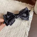 Macro view of elegant black satin polka dot bow hair clip with textured fabric - Banana Clip (HH9723) / Black